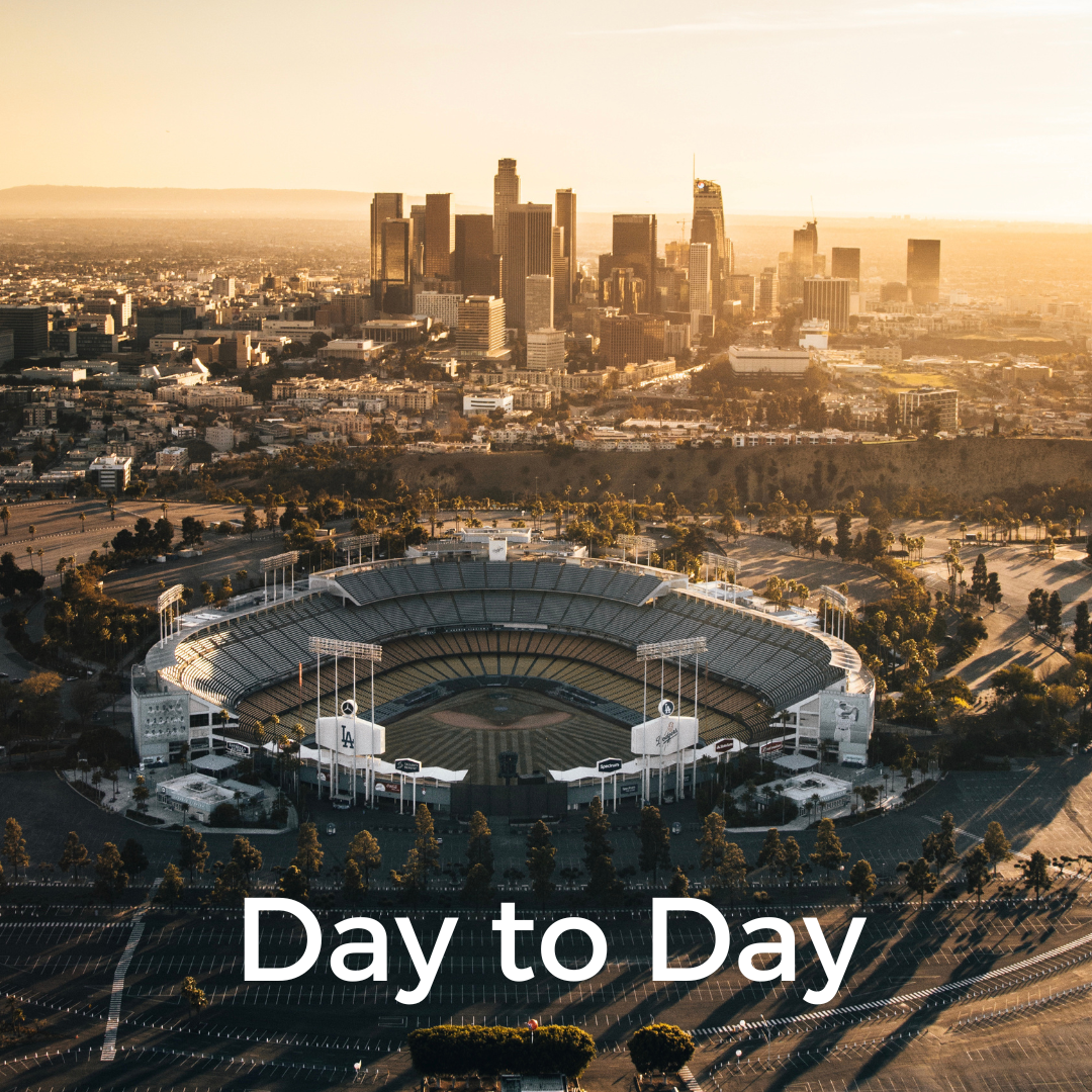 Los Angeles skyline with Dodger Stadium in the foreground and the words Day to Day