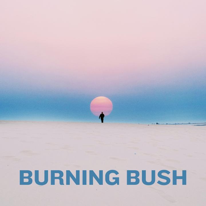 person walking in the desert at sunrise