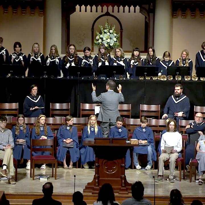 youth ringing handbells during worship