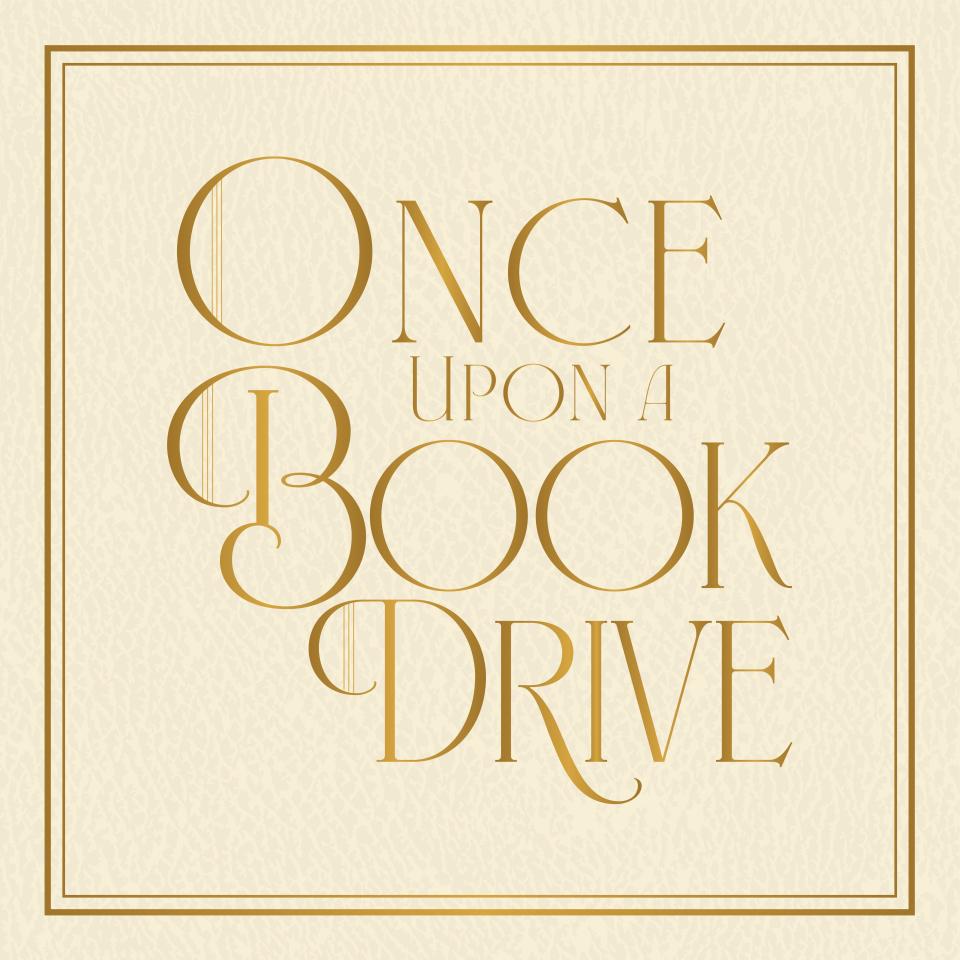 cream colored leather book cover with once upon a book drive written across it
