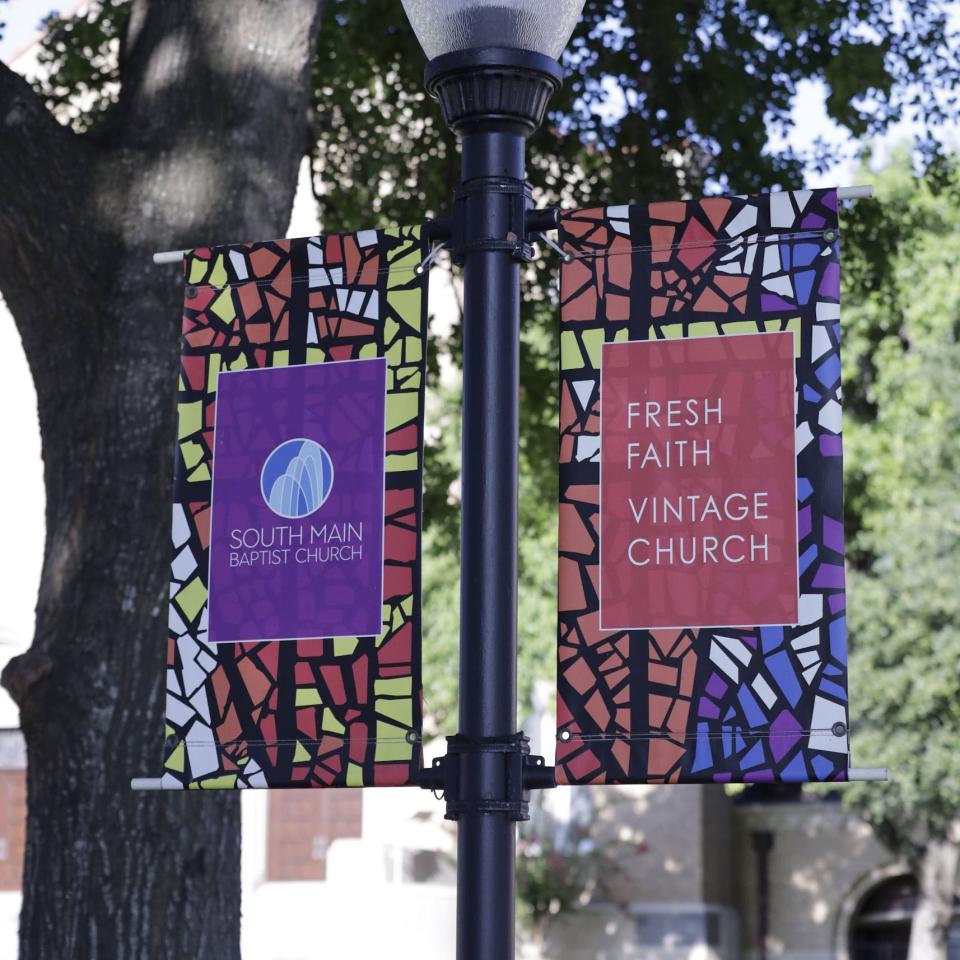 Flags on the SMBC campus displaying the logo and words Fresh Faith, Vintage Church